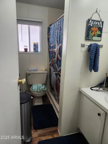 a view of bathroom with a table and a chair