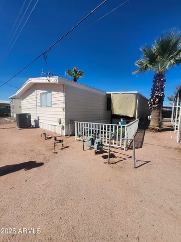 a room with furniture and potted plants