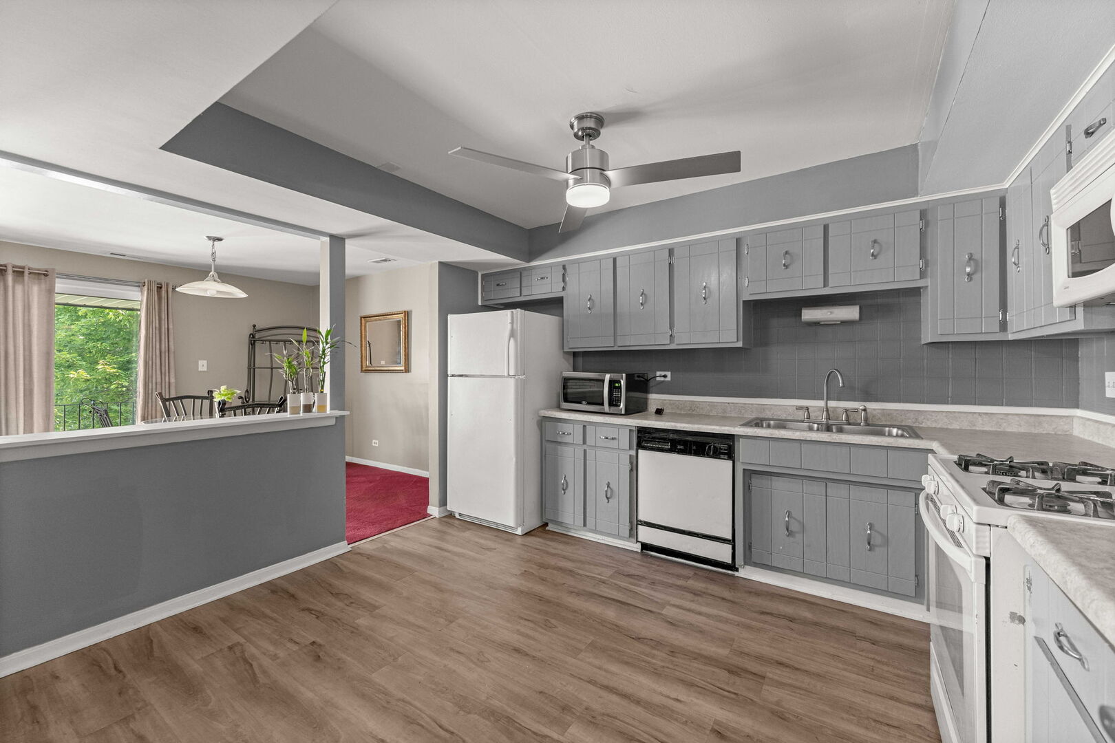 9122 South Pulaski Road, Unit 2E Oak Lawn, IL 60453 - Photo 3 of 16 a kitchen with refrigerator cabinets and wooden floor