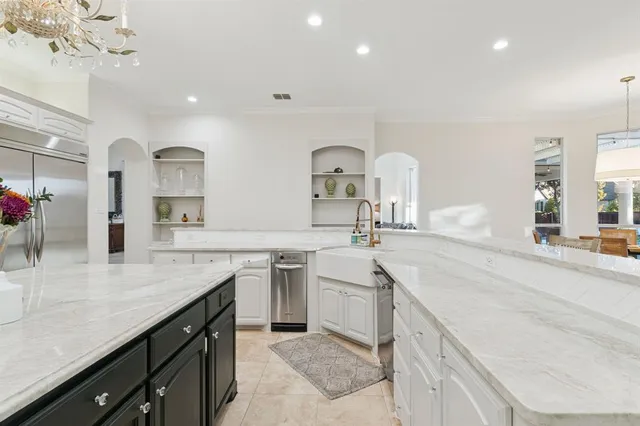 a kitchen with a sink stove and cabinets