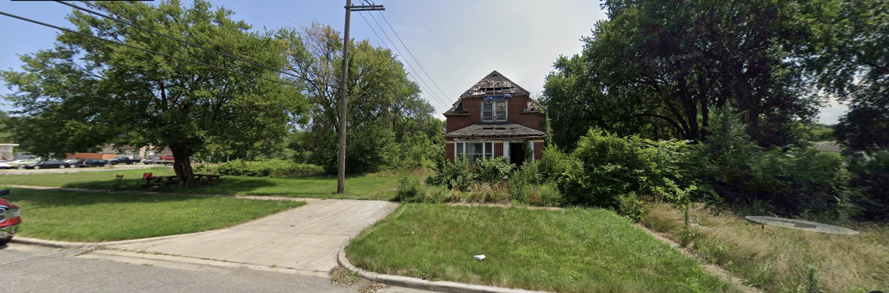 1123 Garfield Street Gary, IN 46404 - Photo 2 of 4 a front view of a house with a yard