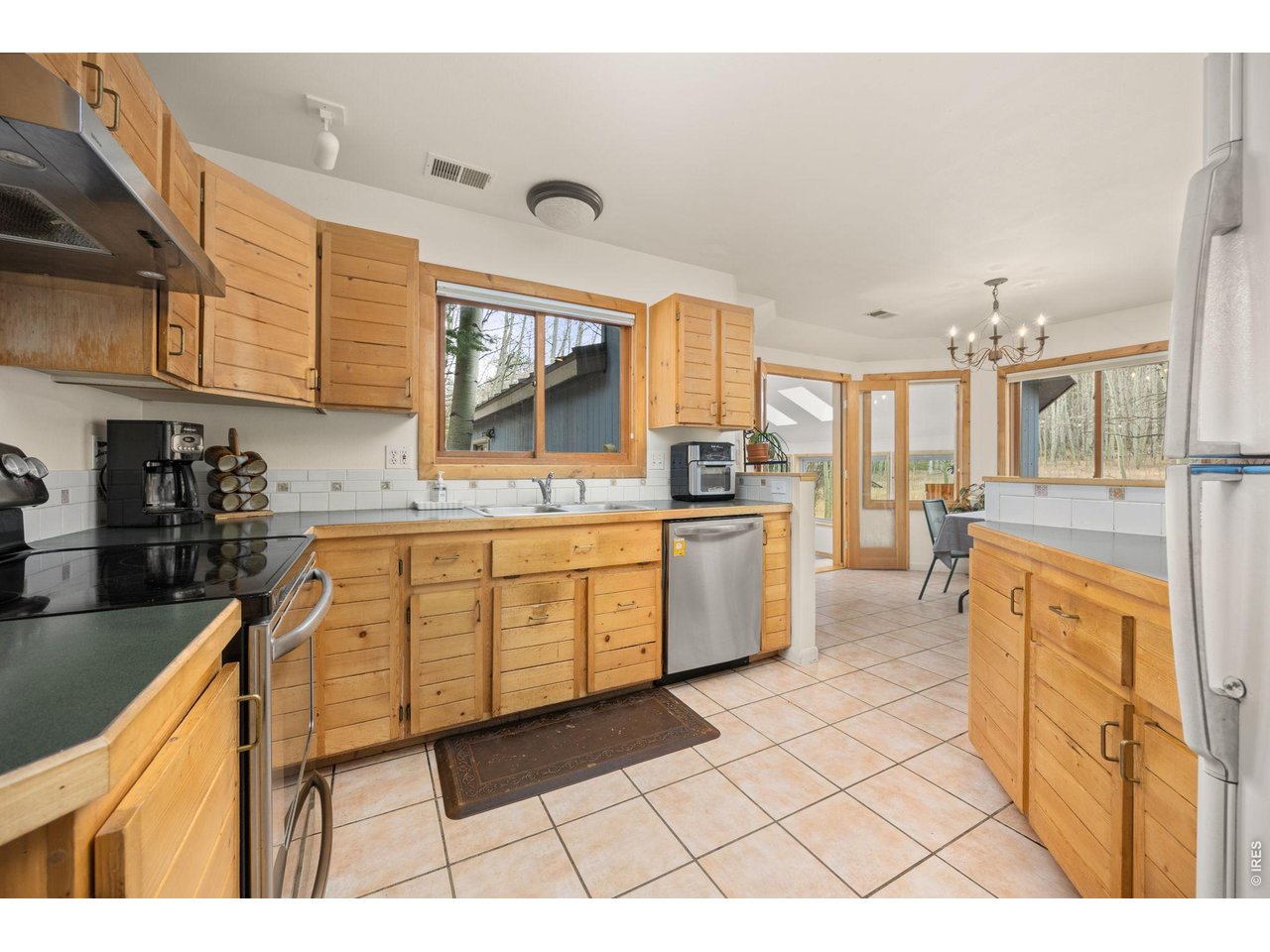 438 North County Road Rollinsville, CO 80474 - Photo 18 of 50 Functional space with a SS dishwasher & electric range/oven