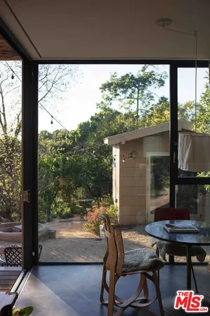 a view of house with yard in background