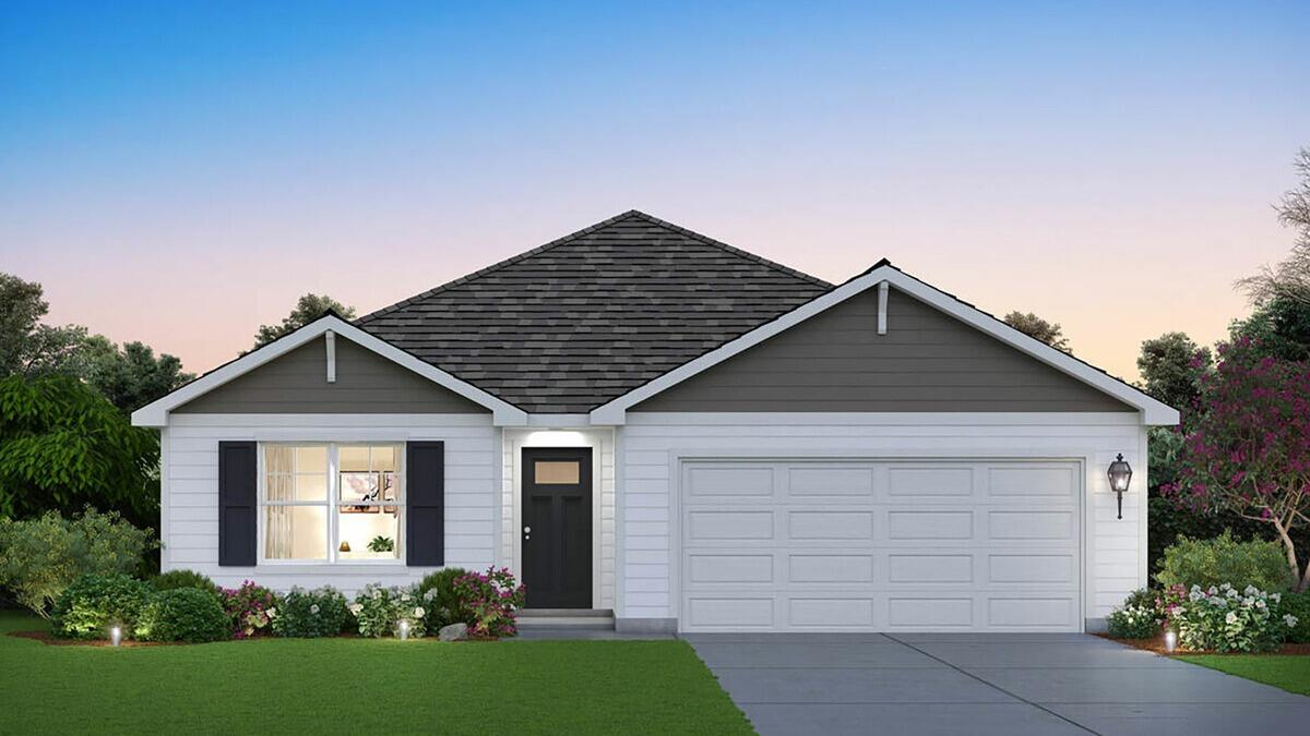 a front view of house with garage and yard