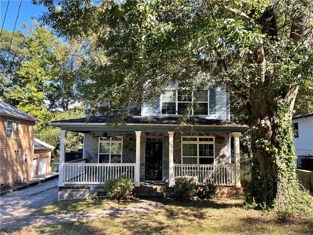 159 Hemphill School Road Northwest Atlanta, GA 30331 - Photo 1 of 1 a front view of a house with garden