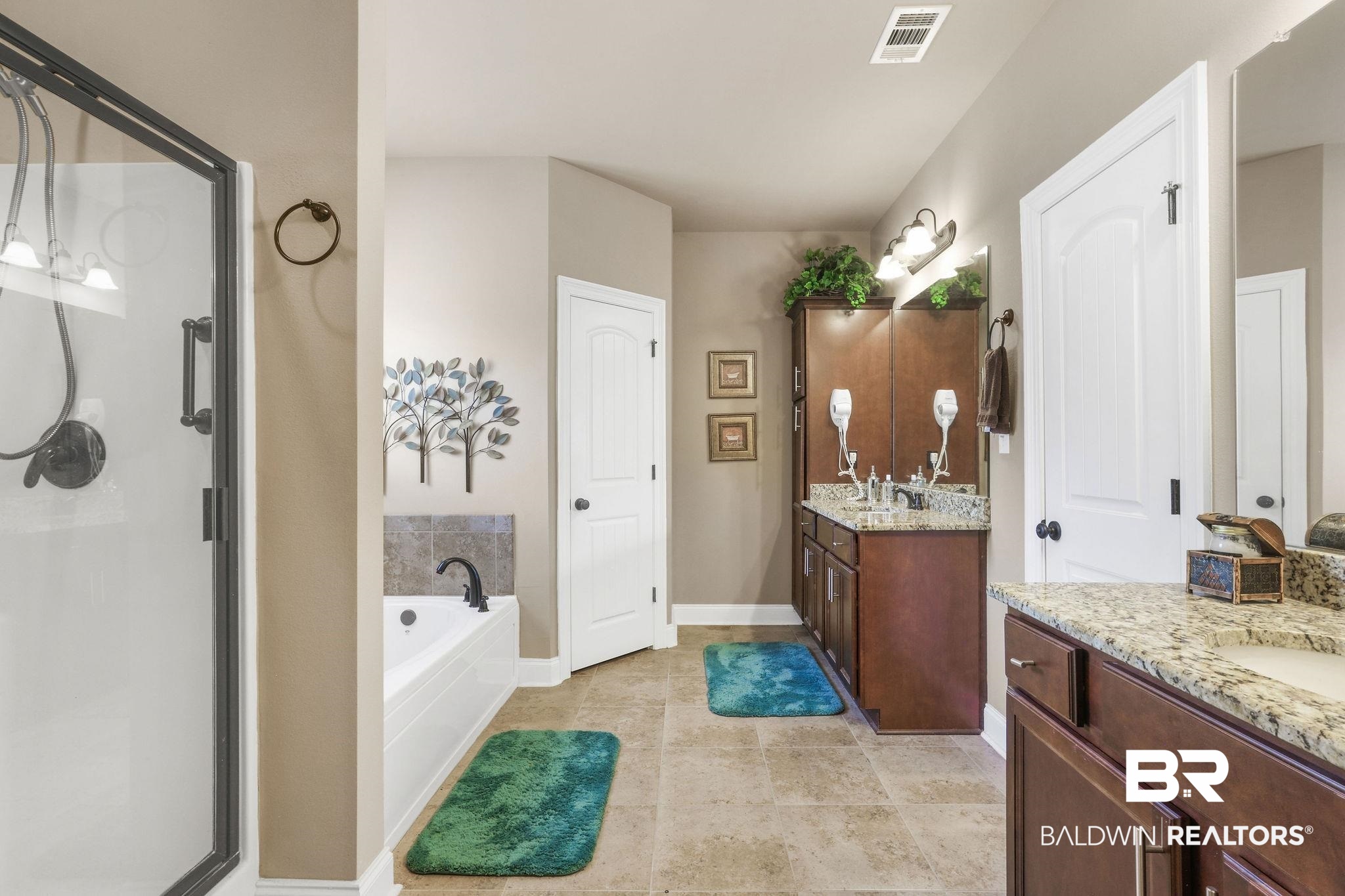 1090 Destin Avenue Foley, AL 36535 - Photo 12 of 30 Bathroom with a shower stall, two vanities, a garden tub, and baseboards