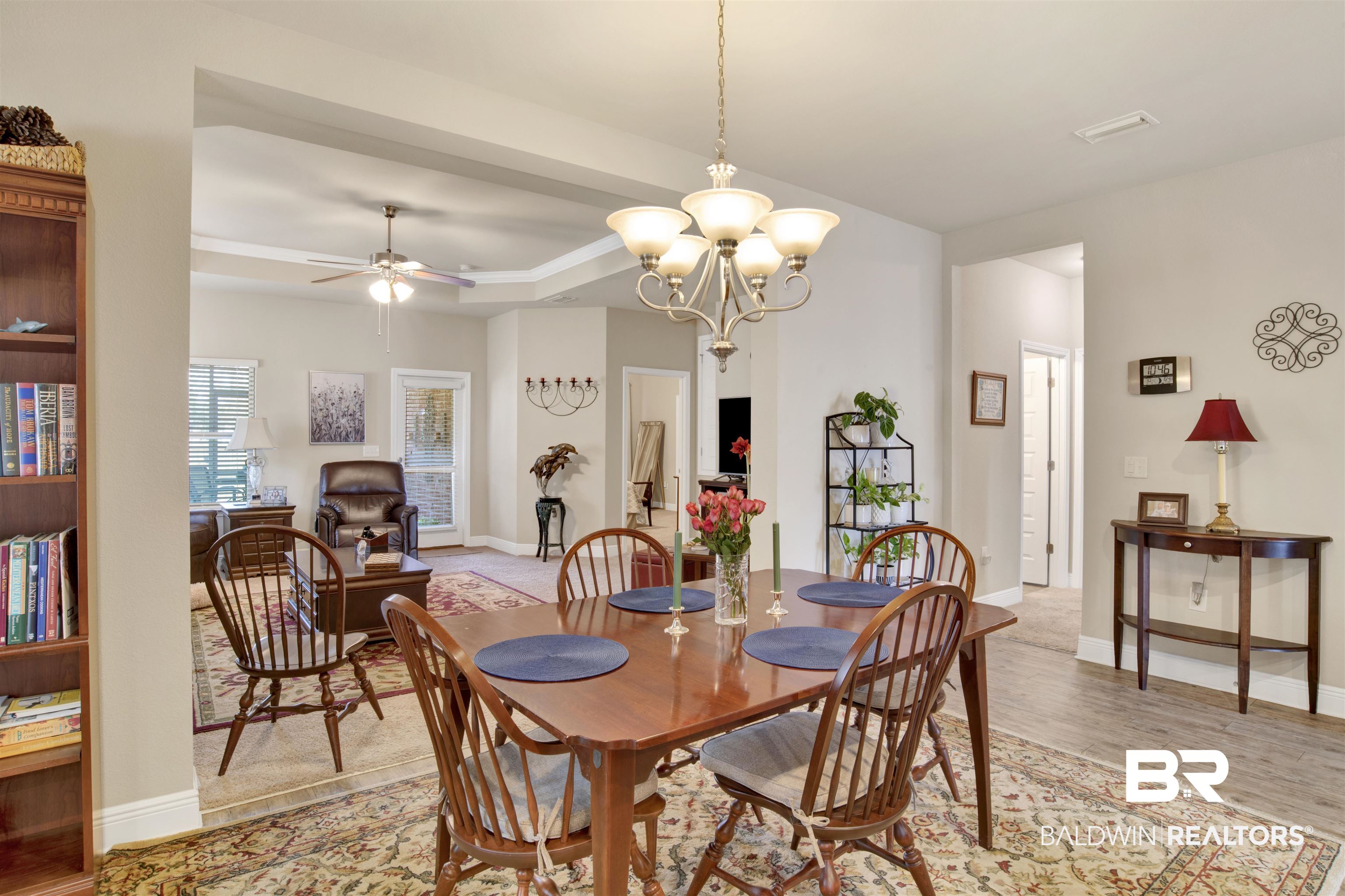 1476 Surrey Loop Foley, AL 36535 - Photo 13 of 31 Dining room with a tray ceiling, ceiling fan with notable chandelier, and light hardwood / wood-style flooring