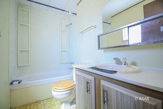 1313 North Leroy Street Ridgecrest, CA 93555 - Photo 23 of 27 a bathroom with a sink a toilet and shower