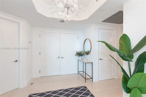a view of entryway with a chandelier