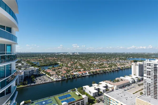 a view of a terrace with lawn chairs