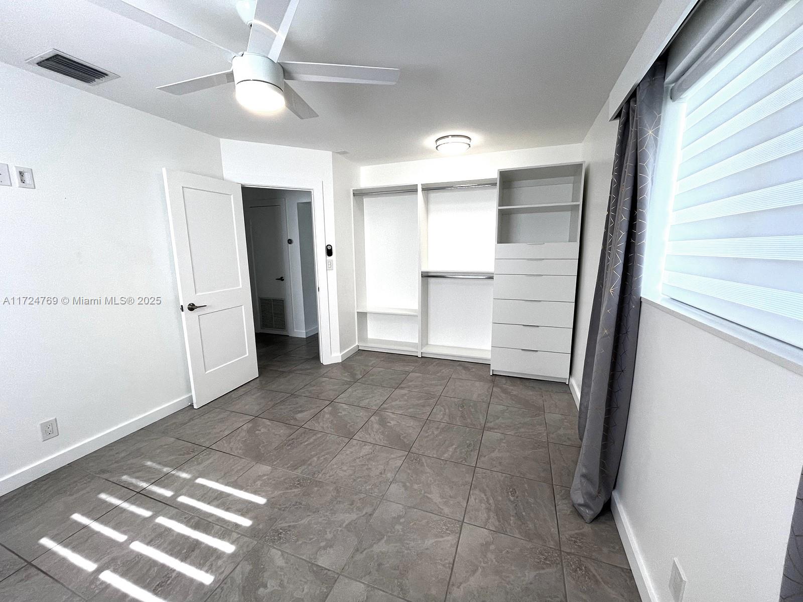 1600 North 56th Avenue Hollywood, FL 33021 - Photo 11 of 25 an empty room with closet and windows