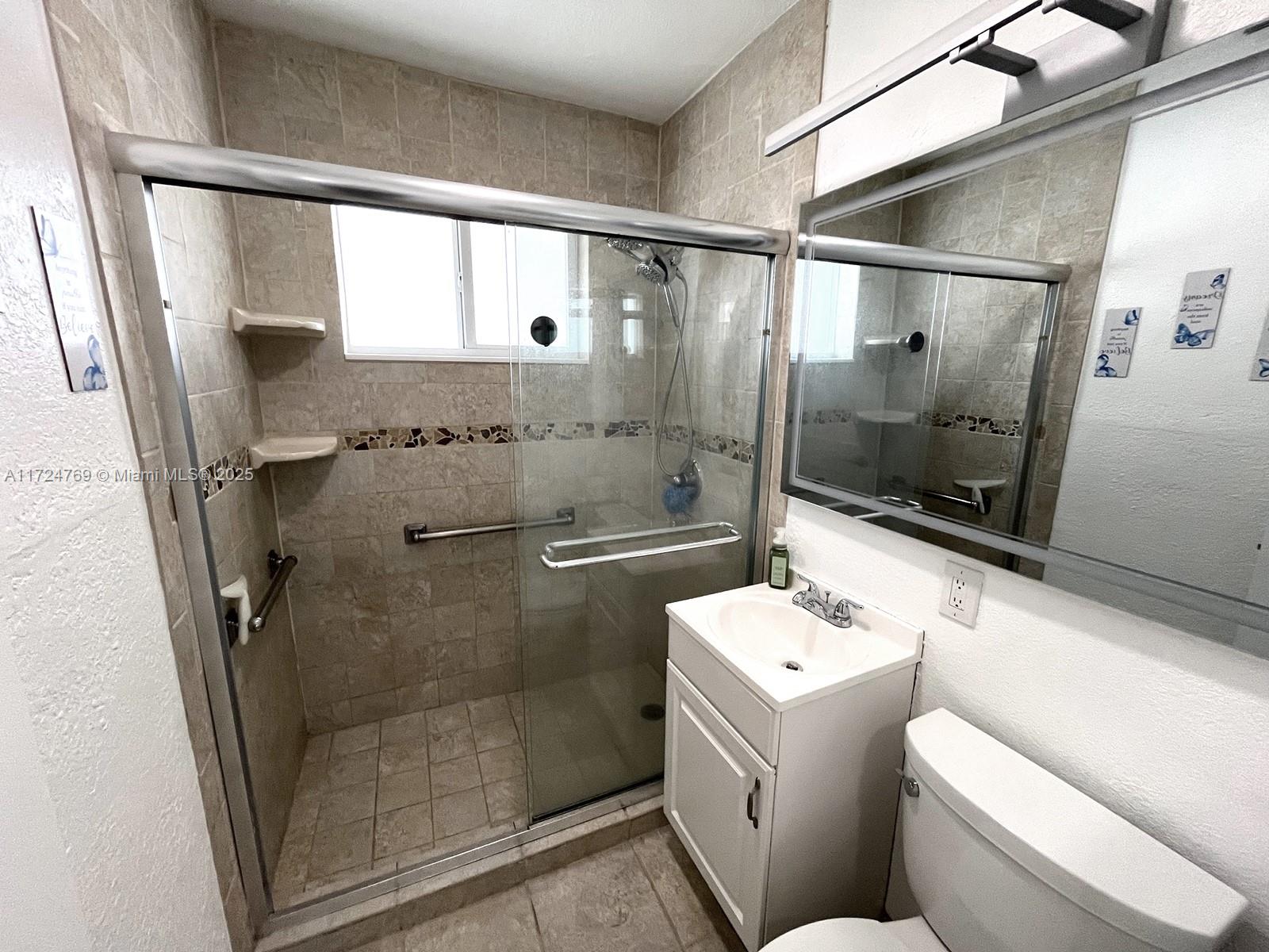 1600 North 56th Avenue Hollywood, FL 33021 - Photo 12 of 25 a bathroom with a sink toilet and shower