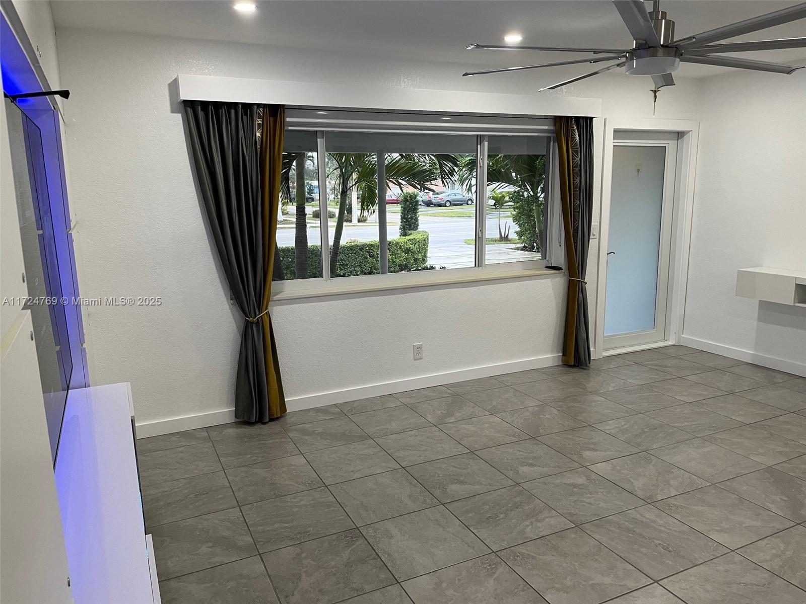 1600 North 56th Avenue Hollywood, FL 33021 - Photo 5 of 25 a view of an empty room with a window
