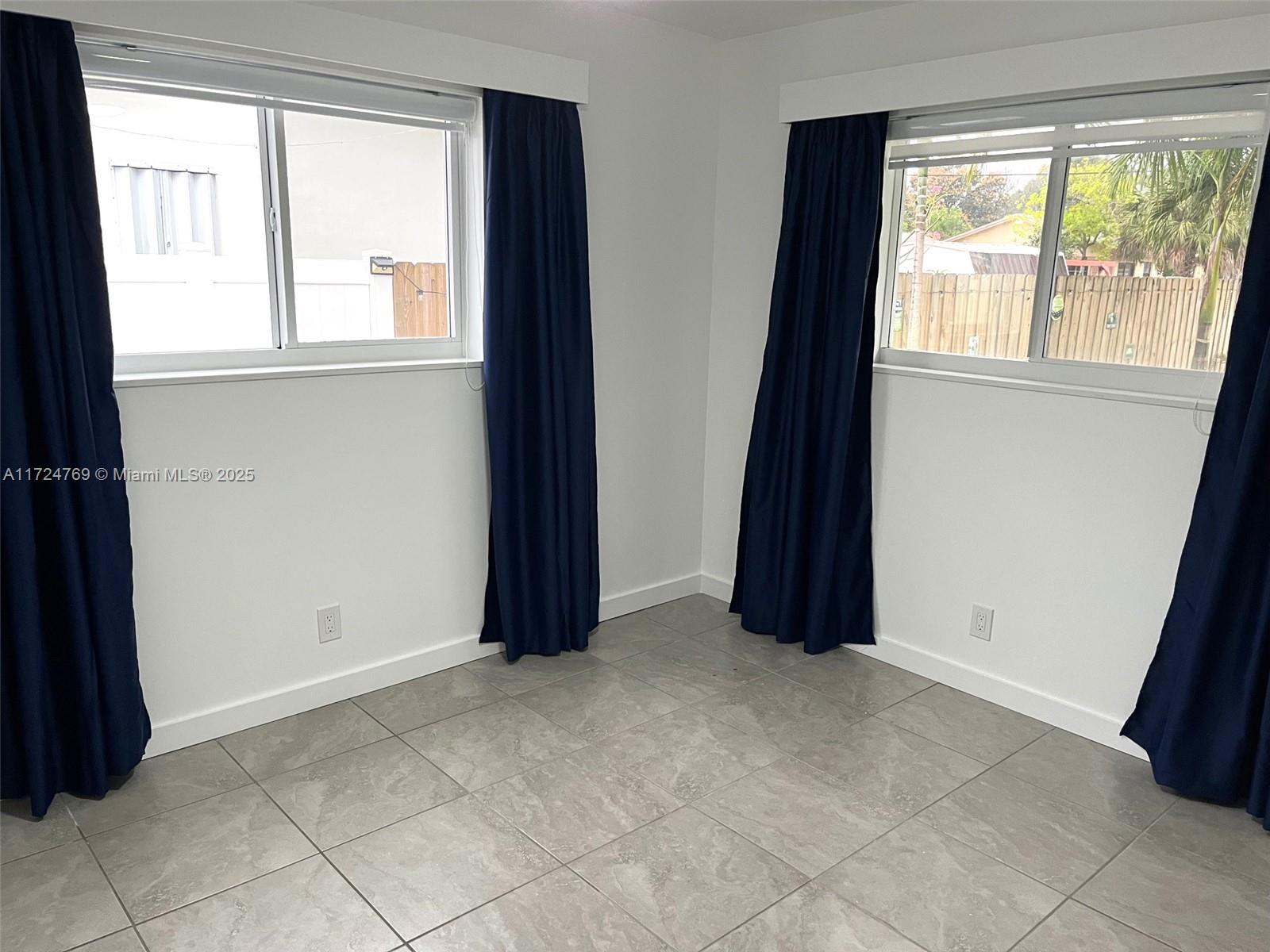 1600 North 56th Avenue Hollywood, FL 33021 - Photo 8 of 25 an empty room with windows