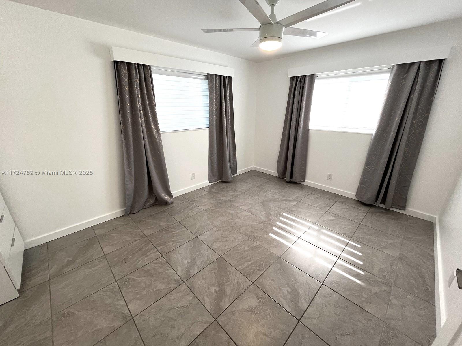 1600 North 56th Avenue Hollywood, FL 33021 - Photo 10 of 25 an empty room with windows and closet