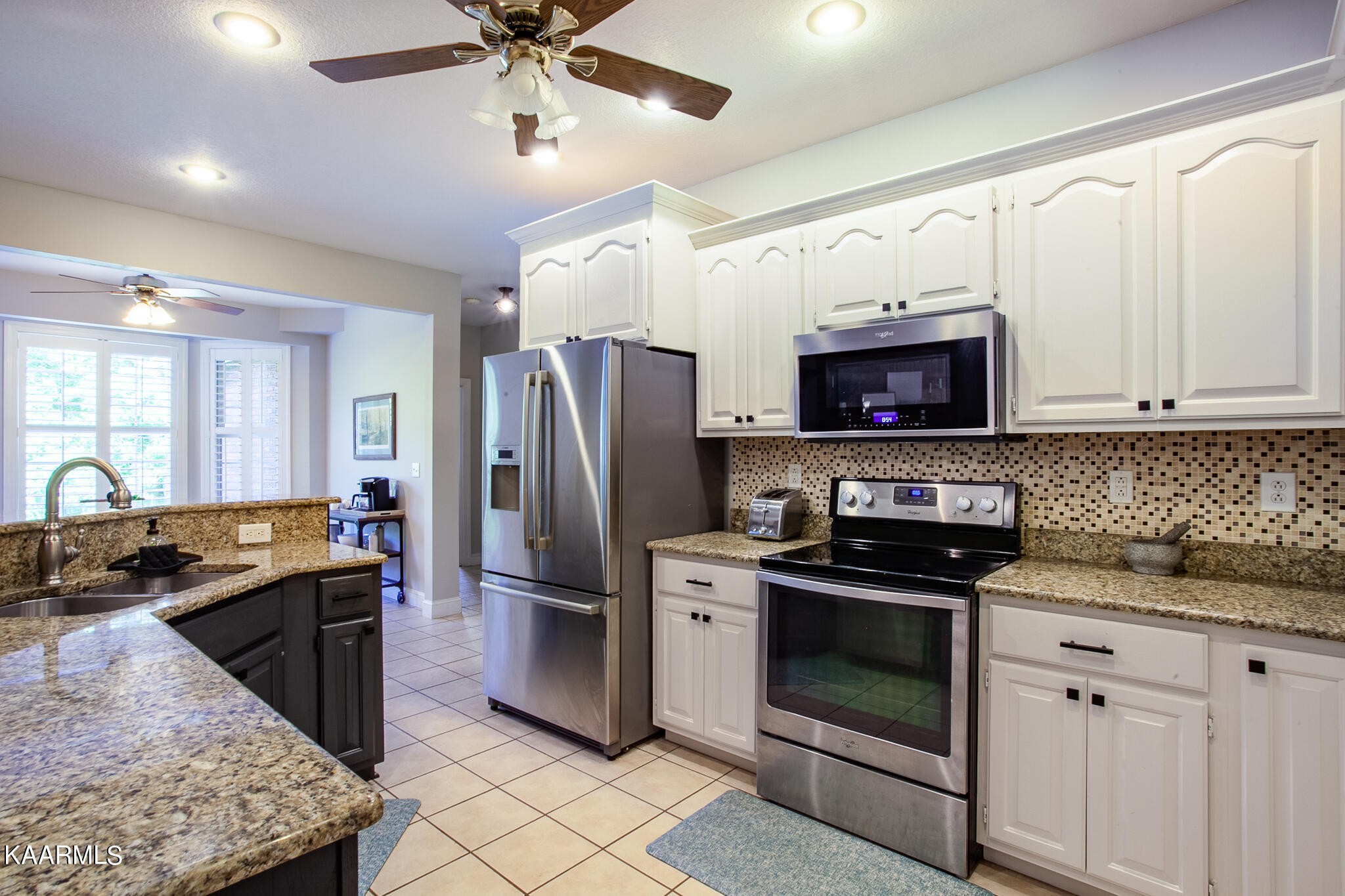 610 Dry Valley Road Townsend, TN 37882 - Photo 13 of 37 a kitchen with granite countertop a refrigerator stove and microwave