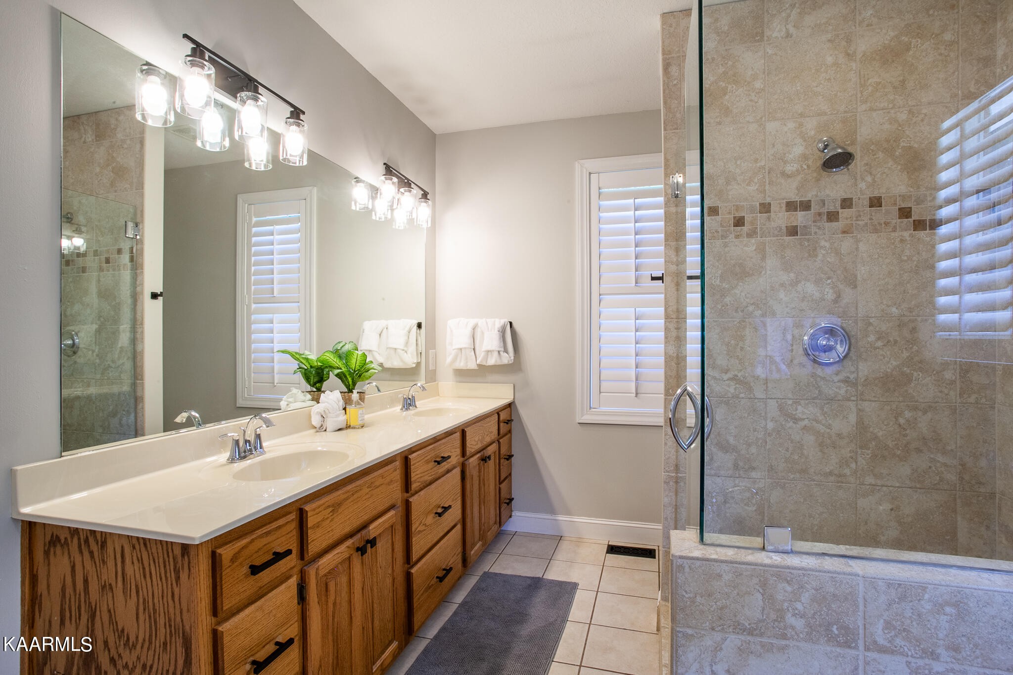 610 Dry Valley Road Townsend, TN 37882 - Photo 21 of 37 a bathroom with a sink a mirror and a shower