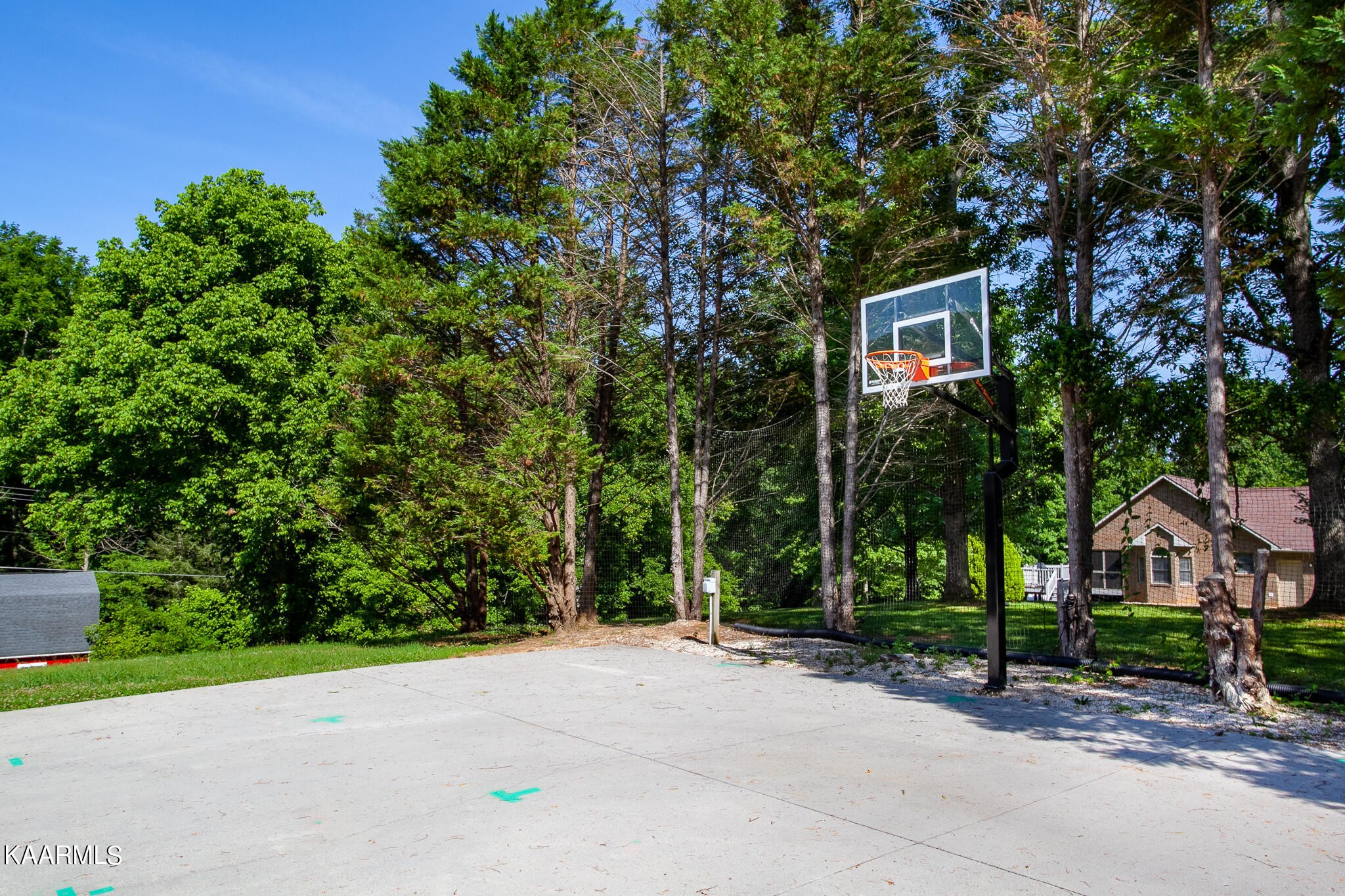 610 Dry Valley Road Townsend, TN 37882 - Photo 34 of 37 a sign that is sitting in front of a brick house with large trees