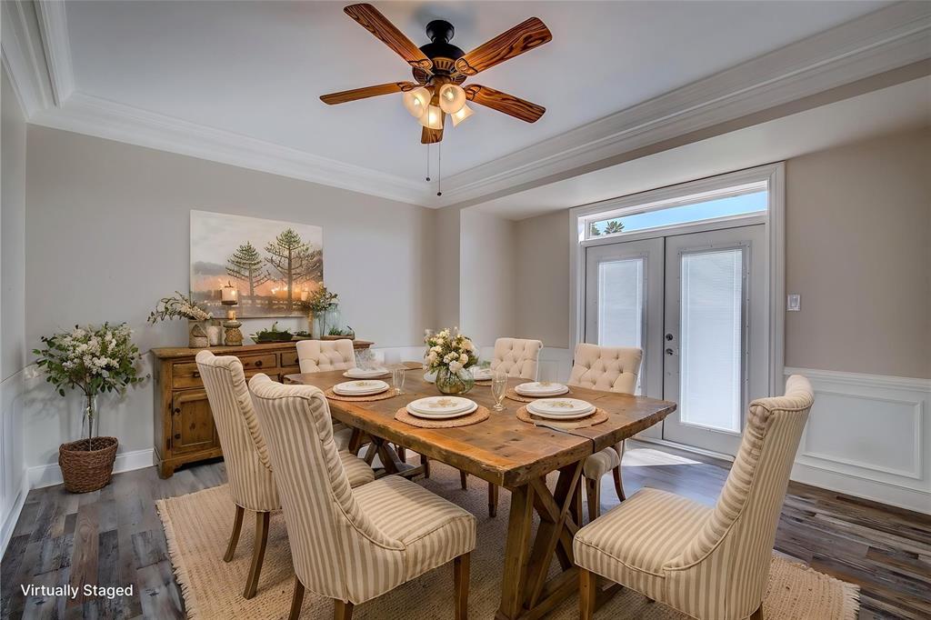 7359 Highway 154 Sulphur Springs, TX 75482 - Photo 12 of 40 Formal dining has french doors to back porch and pool area, trey ceiling, crown molding, wainscoting, 6-inch baseboards