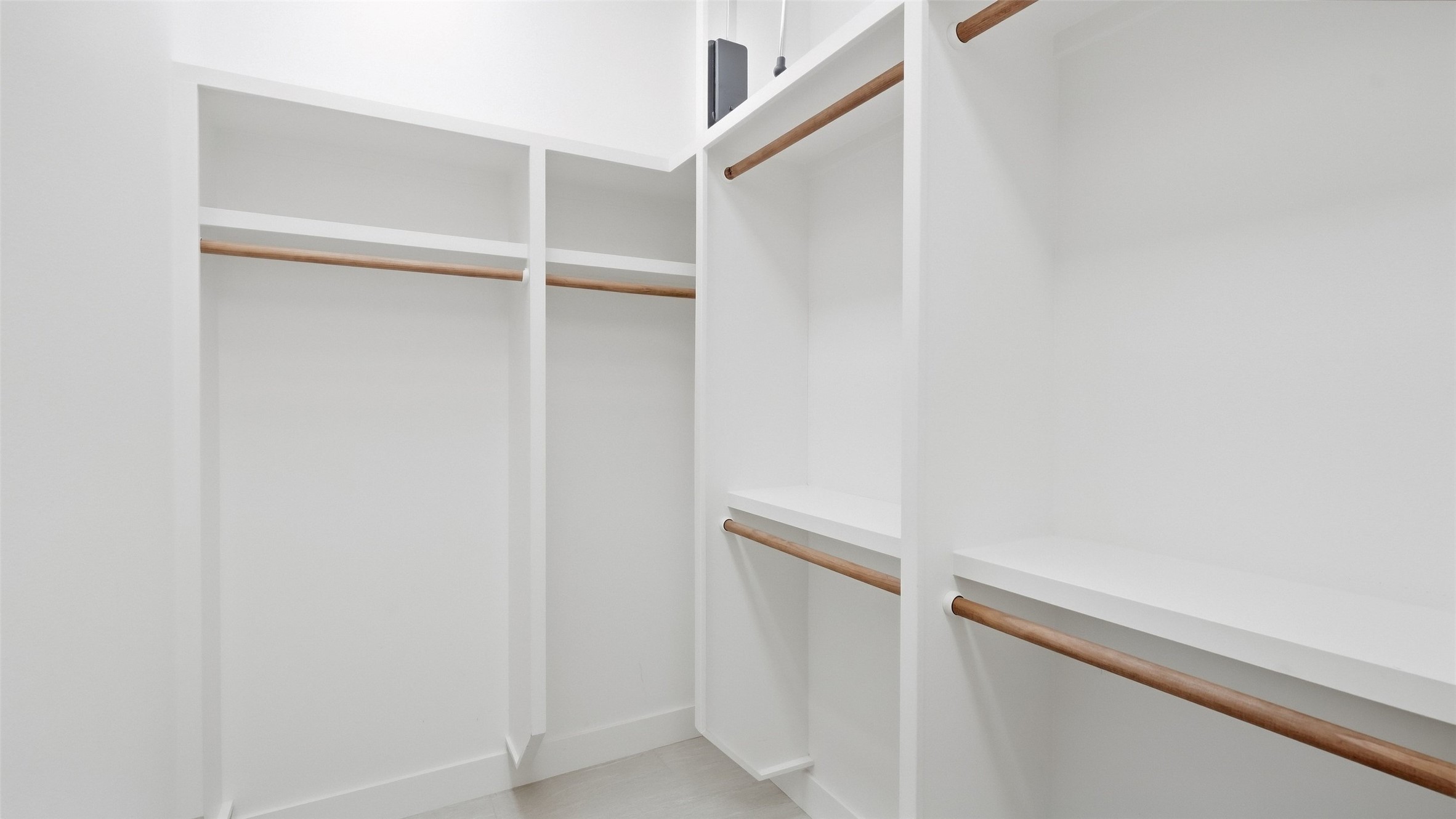 5910 Hudson Bend Road Austin, TX 78734 - Photo 18 of 40 Custom built-in shelving and hanging rods maximize storage in this walk-in closet.