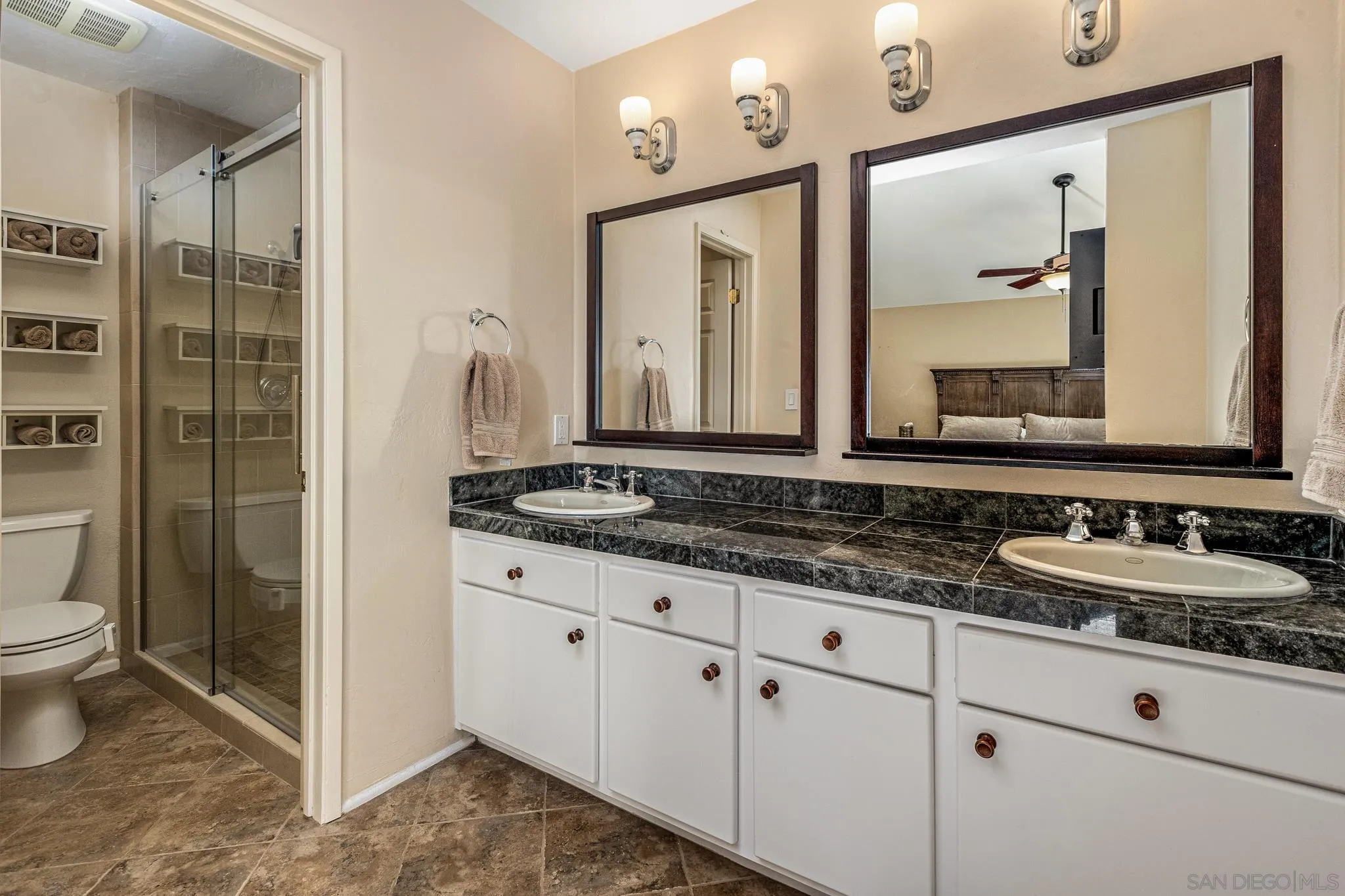 3115 Via De Caballo Encinitas, CA 92024 - Photo 25 of 39 a bathroom with a granite countertop sink mirror and toilet