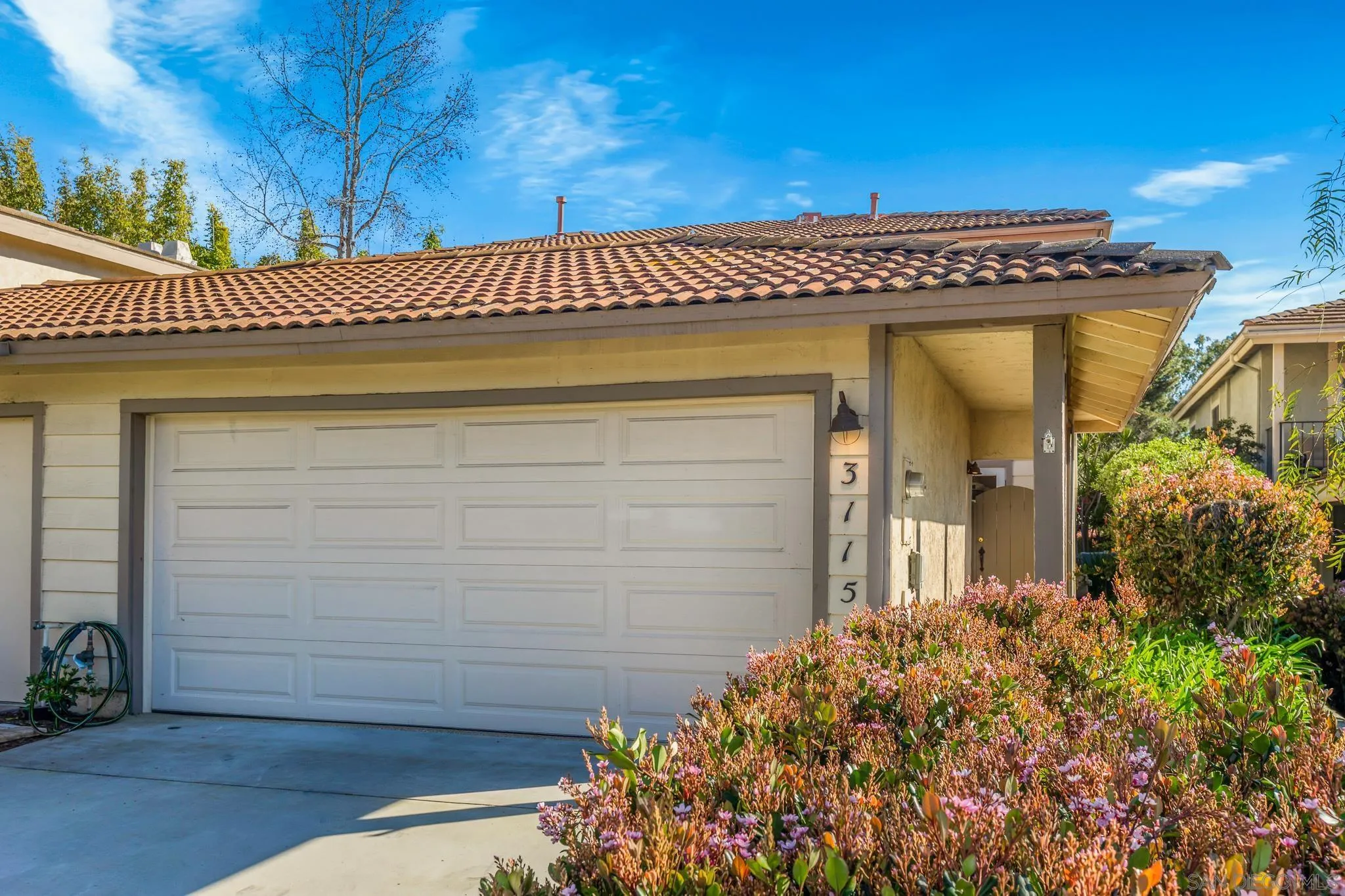 3115 Via De Caballo Encinitas, CA 92024 - Photo 32 of 39 a view of a house with a flower garden