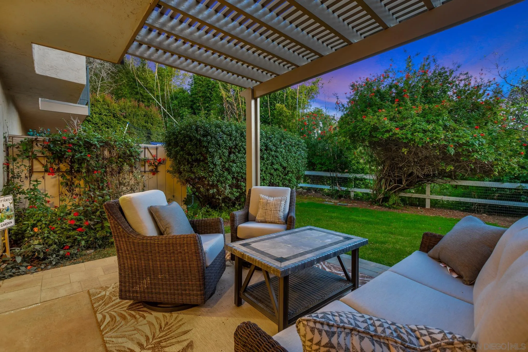 3115 Via De Caballo Encinitas, CA 92024 - Photo 4 of 39 a view of a patio with couches table and chairs with garden view