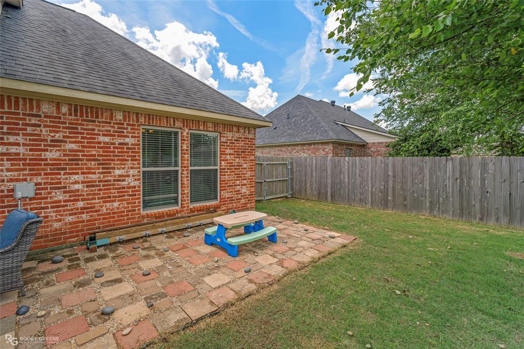 711 Reeds Reef Bossier City, LA 71112 - Photo 35 of 36 a backyard of a house with table and chairs