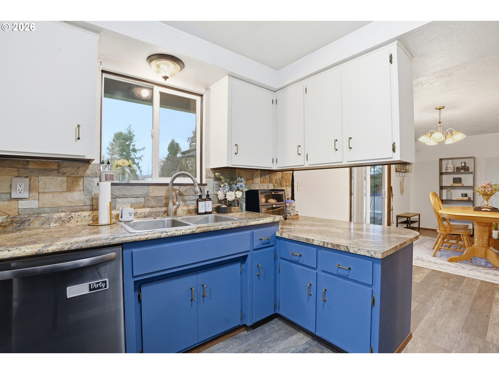 224 6th Street Dayton, OR 97114 - Photo 11 of 37 a kitchen with granite countertop a sink stainless steel appliances and cabinets