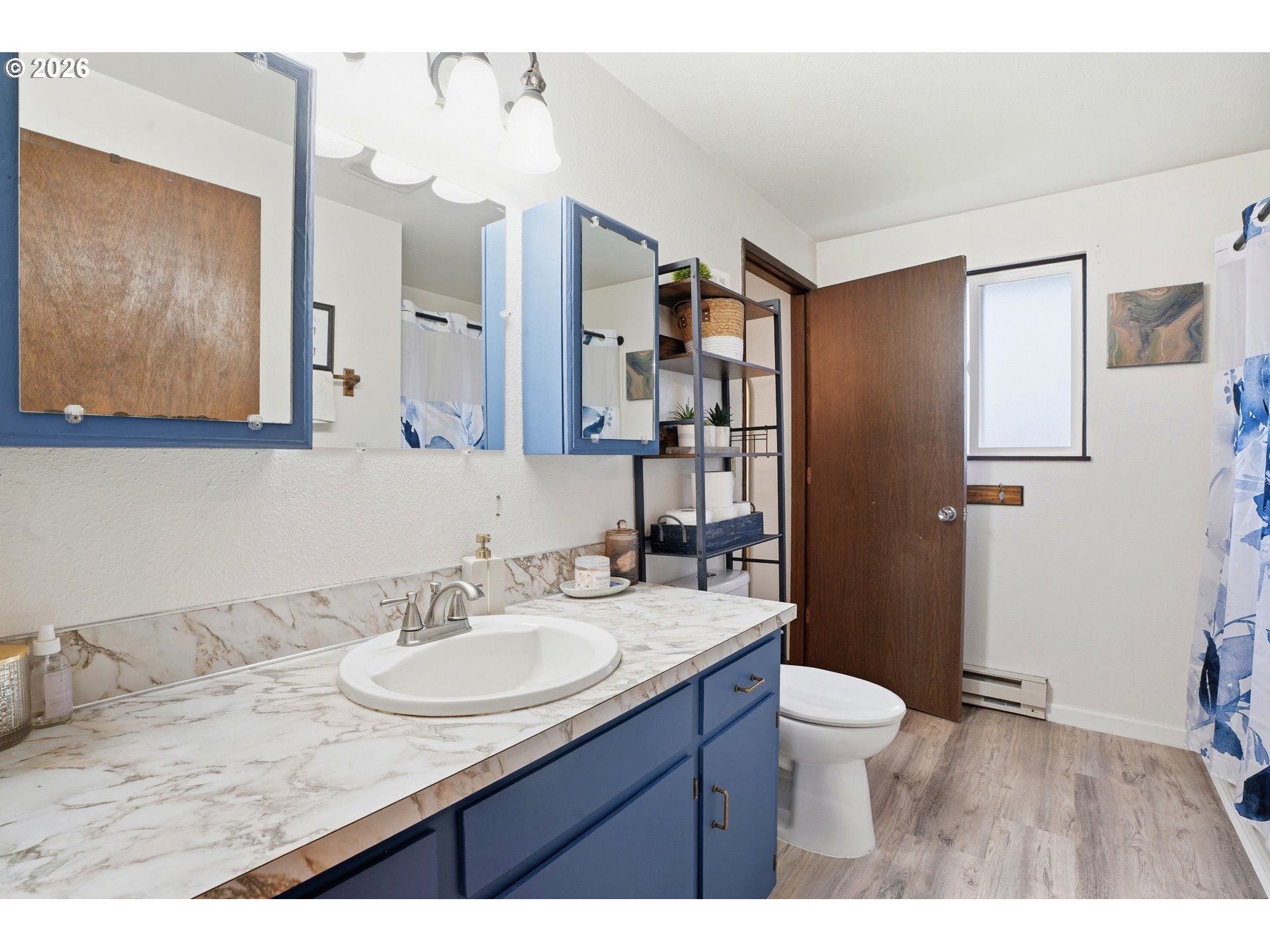224 6th Street Dayton, OR 97114 - Photo 21 of 37 a bathroom with a granite countertop sink toilet and shower