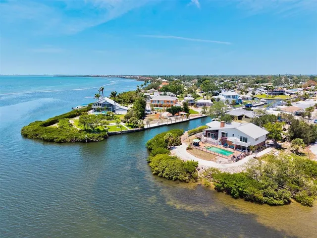 an aerial view of a house with a ocean view