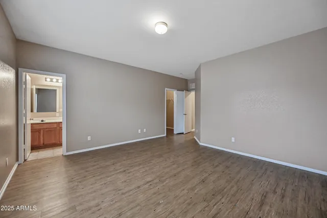 a view of an empty room with a bathroom