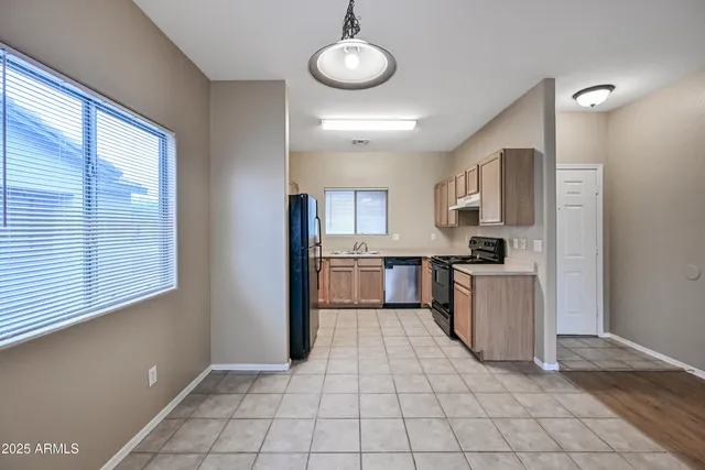 a view of a kitchen with electric appliances