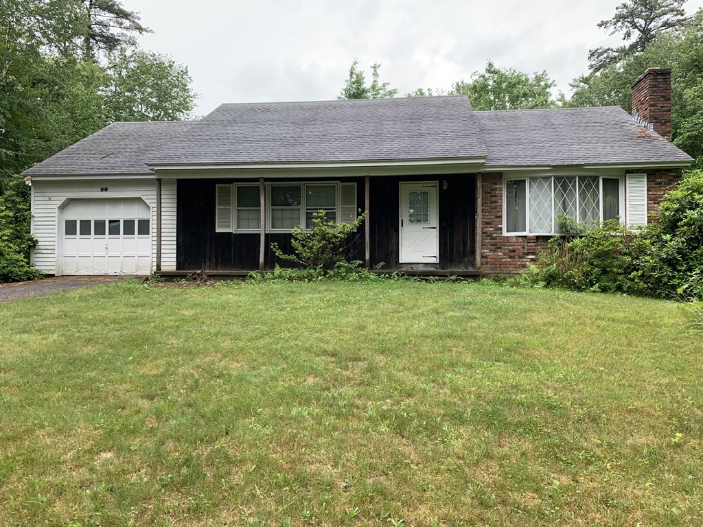 59 Beebe Road Monson, MA 01057 - Photo 1 of 14 a front view of a house with yard and porch