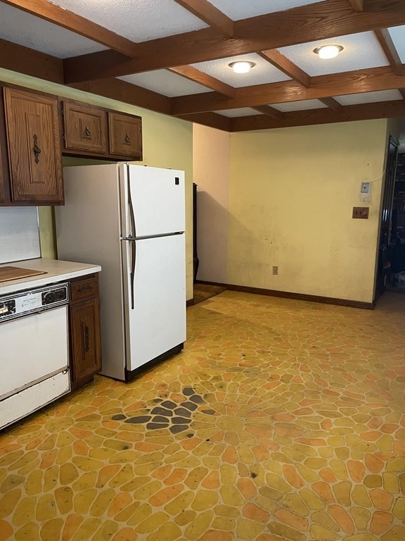 59 Beebe Road Monson, MA 01057 - Photo 2 of 14 a view of a refrigerator in kitchen and an empty room