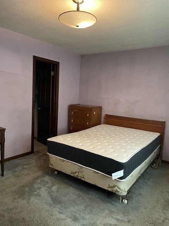 59 Beebe Road Monson, MA 01057 - Photo 6 of 14 a bedroom with a bed and lamp