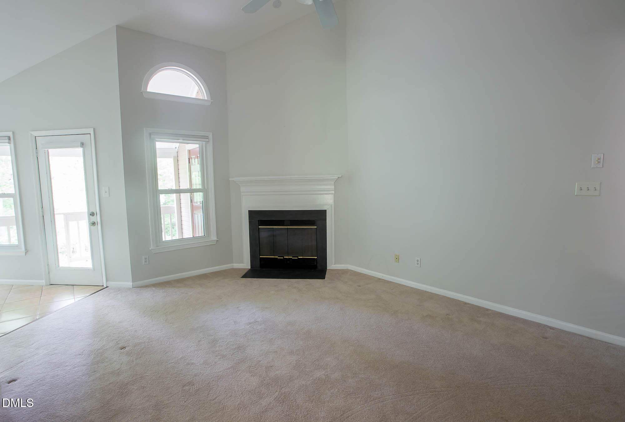 115 Abingdon Court, Unit 2B Cary, NC 27513 - Photo 2 of 9 an empty room with windows