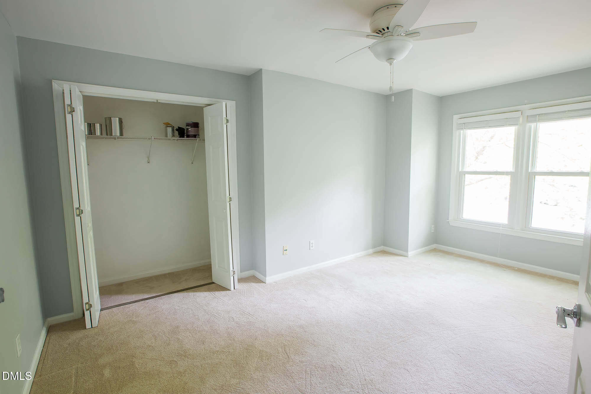 115 Abingdon Court, Unit 2B Cary, NC 27513 - Photo 5 of 9 a view of an empty room with a window