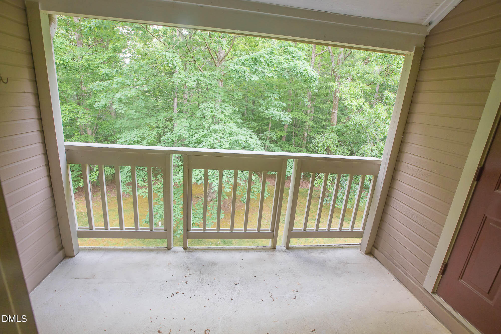 115 Abingdon Court, Unit 2B Cary, NC 27513 - Photo 9 of 9 a view of an empty room with a balcony