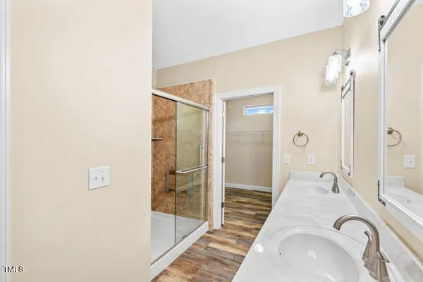a bathroom with a double vanity sink and a mirror
