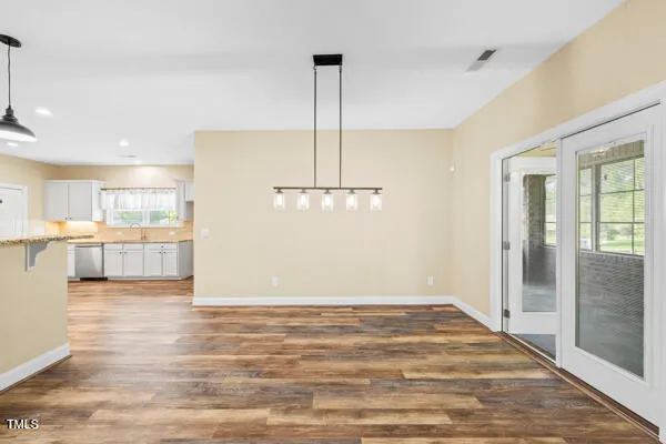 a view of a kitchen with a stove and kitchen view