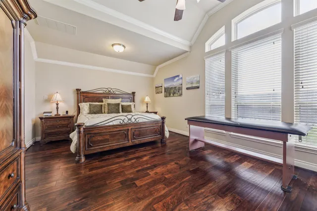 a spacious bathroom with a granite countertop sink a mirror and a bathtub