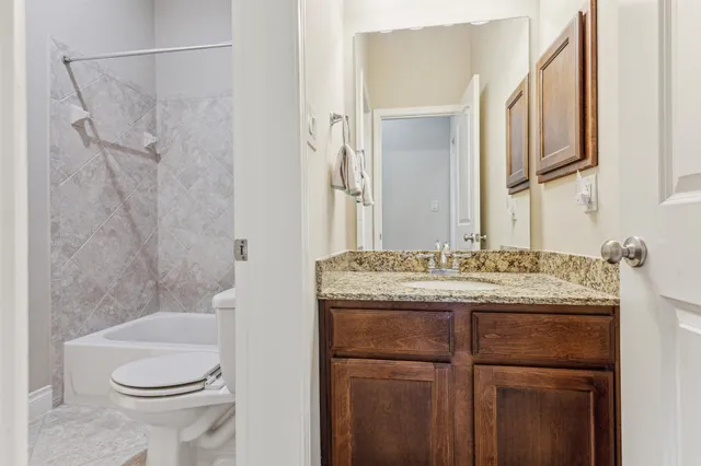 a utility room with cabinets washer and dryer