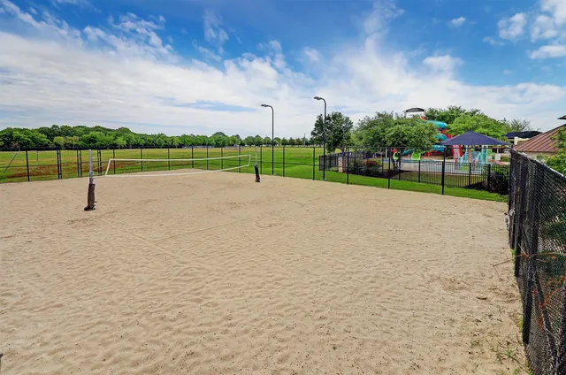 a childrens park with lots of swings and slides