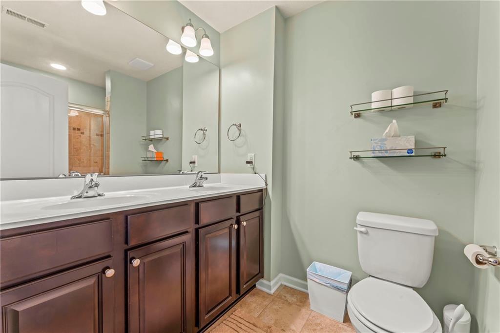 2 Truman Circle McKees Rocks, PA 15136 - Photo 16 of 26 a bathroom with a toilet a sink and mirror