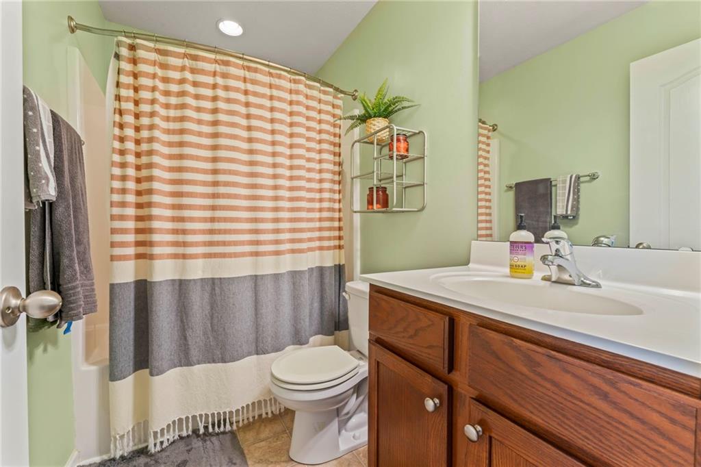 2 Truman Circle McKees Rocks, PA 15136 - Photo 19 of 26 a bathroom with a sink a toilet and mirror