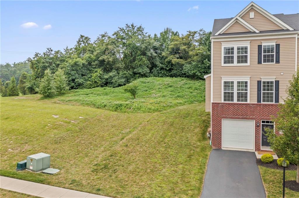2 Truman Circle McKees Rocks, PA 15136 - Photo 2 of 26 a front view of a house with garden