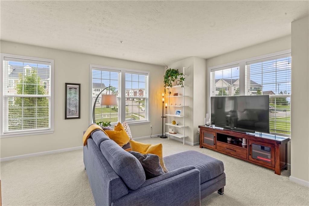 2 Truman Circle McKees Rocks, PA 15136 - Photo 9 of 26 a living room with furniture and a flat screen tv