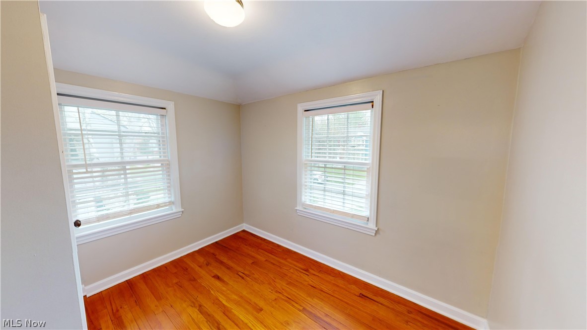 5175 Mayview Road Cleveland, OH 44124 - Photo 10 of 14 Unfurnished room with wood-type flooring and a healthy amount of sunlight