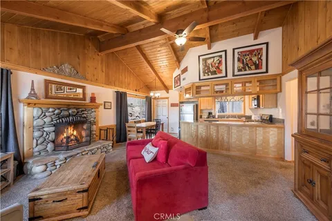 a living room with furniture gym equipment and a fireplace